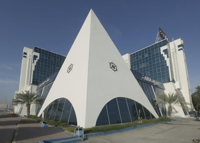Gulf Craft's headquarters are in a modern building in Ajman at the site of the original factory , but superyacht production takes place at nearby Umm Al Quwain