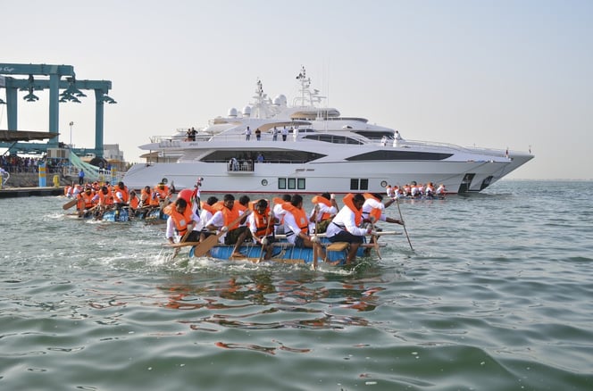 Gulf Craft Raft Race finals with the Majesty 122 in the background.