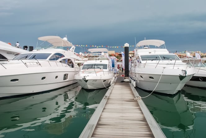 Majesty 56 (center) and Majesty 63 (right) on water display at the Kuwait Yacht Show